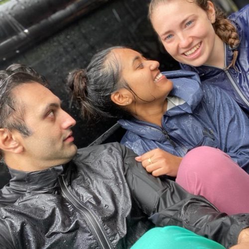 :Mandeep Sablok, Rutu Shah, and Payton Schwesinger getting soaked on the way down the hill from clinic.  Still all smiles!